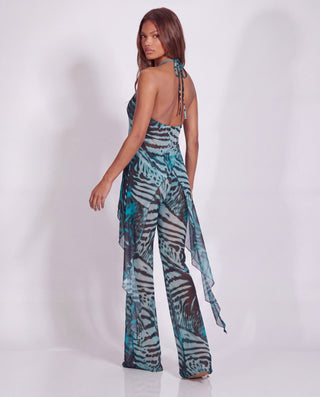 WHO IS SHE PANTS IN GREEN ANIMAL PRINT